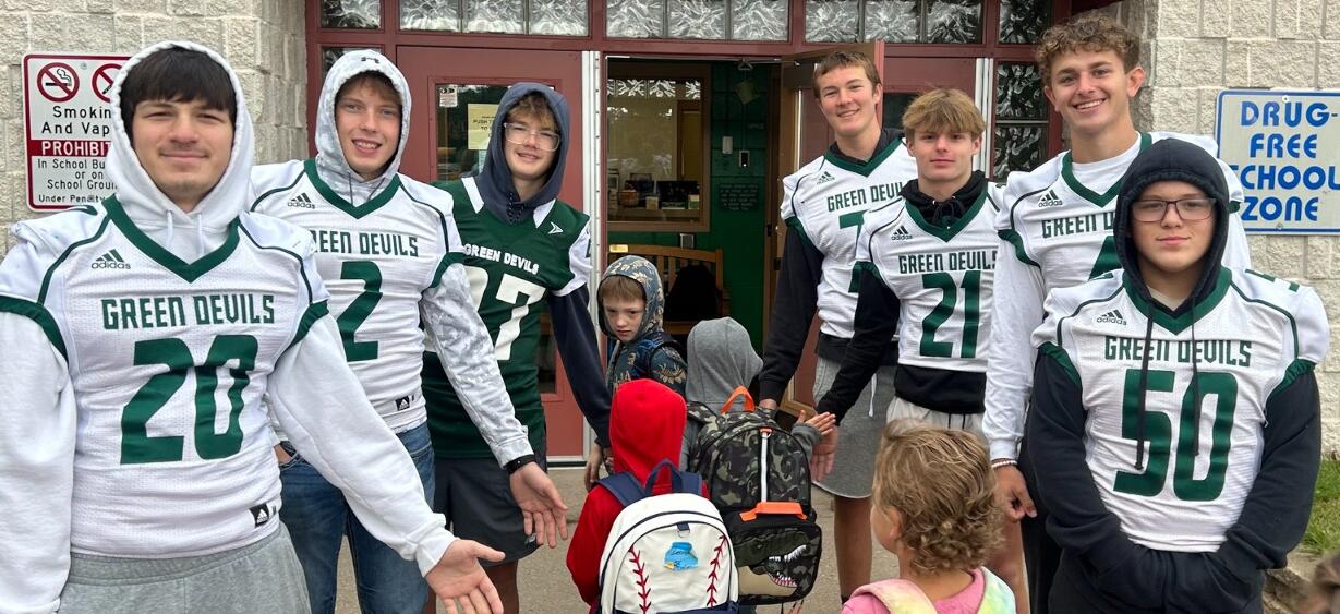 AFHS football players welcome elementary students on first day of school